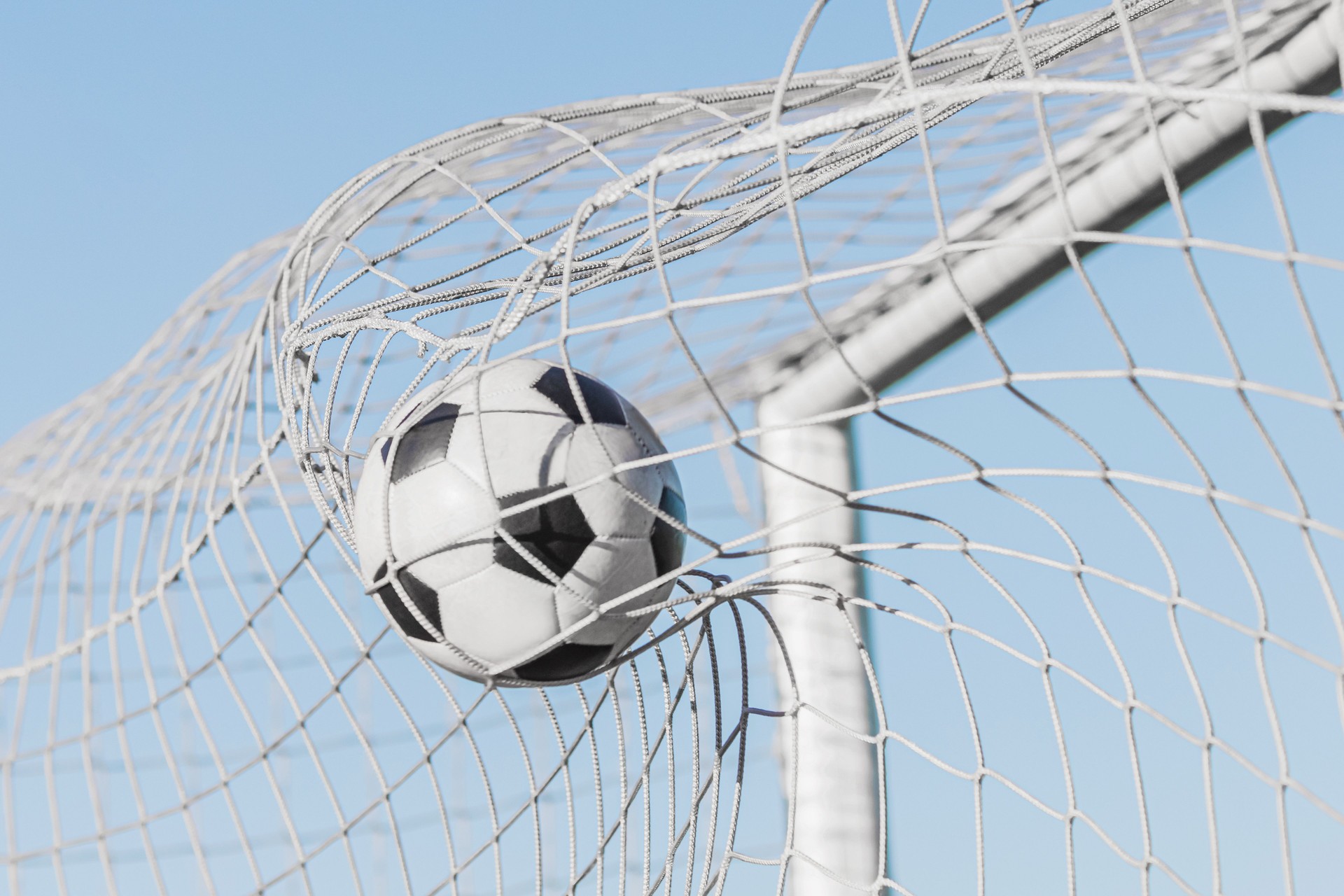 Soccer ball in goal. Football.